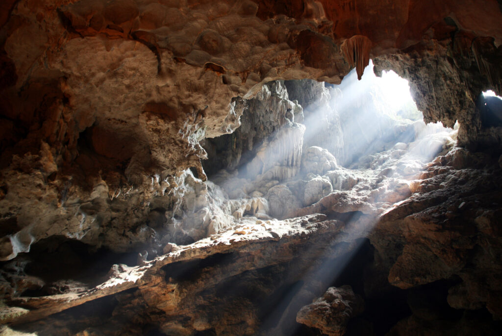 Light bursting through an opening in a cave.